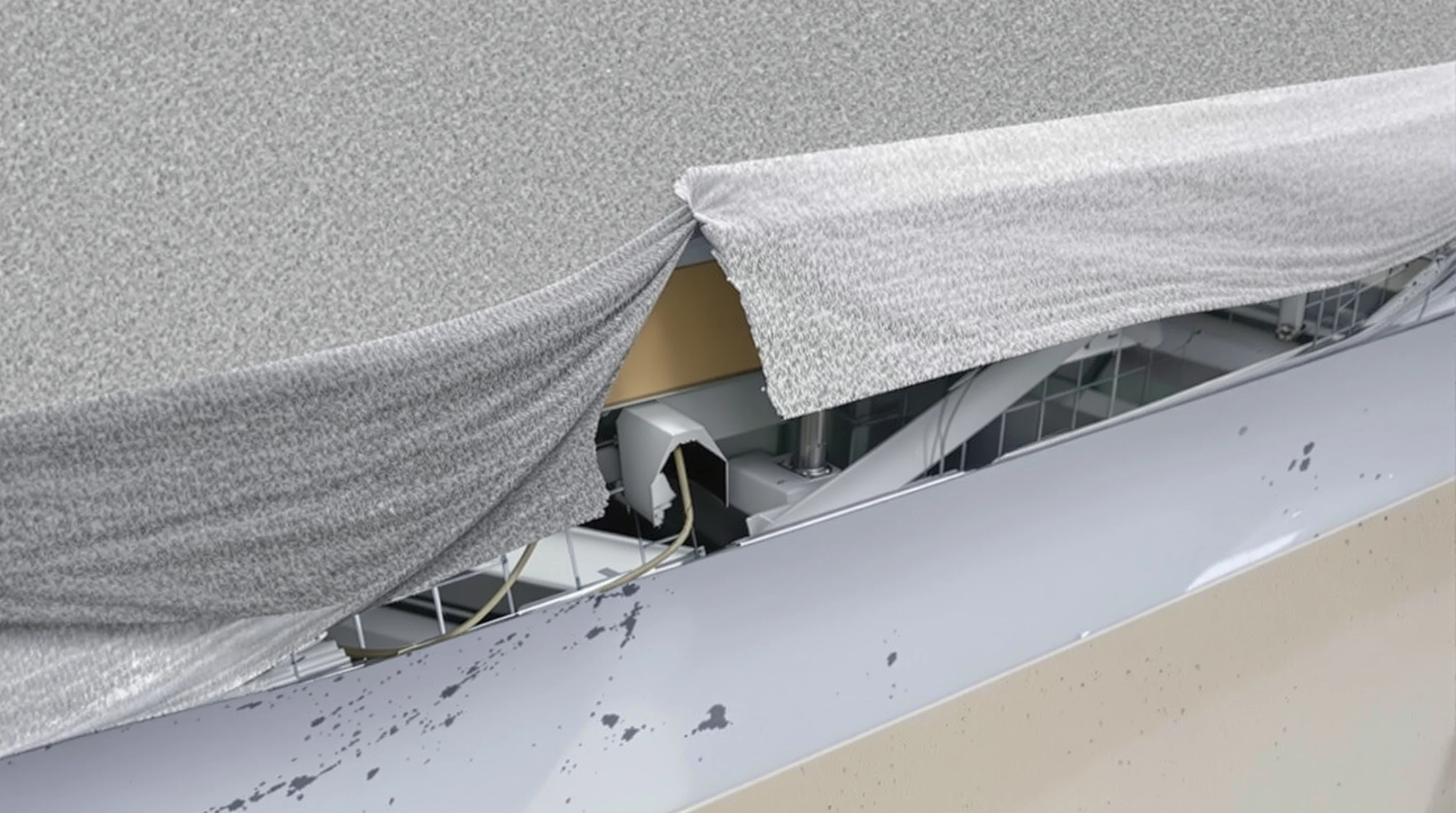 Failed roof flashing at a parapet wall junction, with the membrane separated from the wall and a visible gap where water can enter